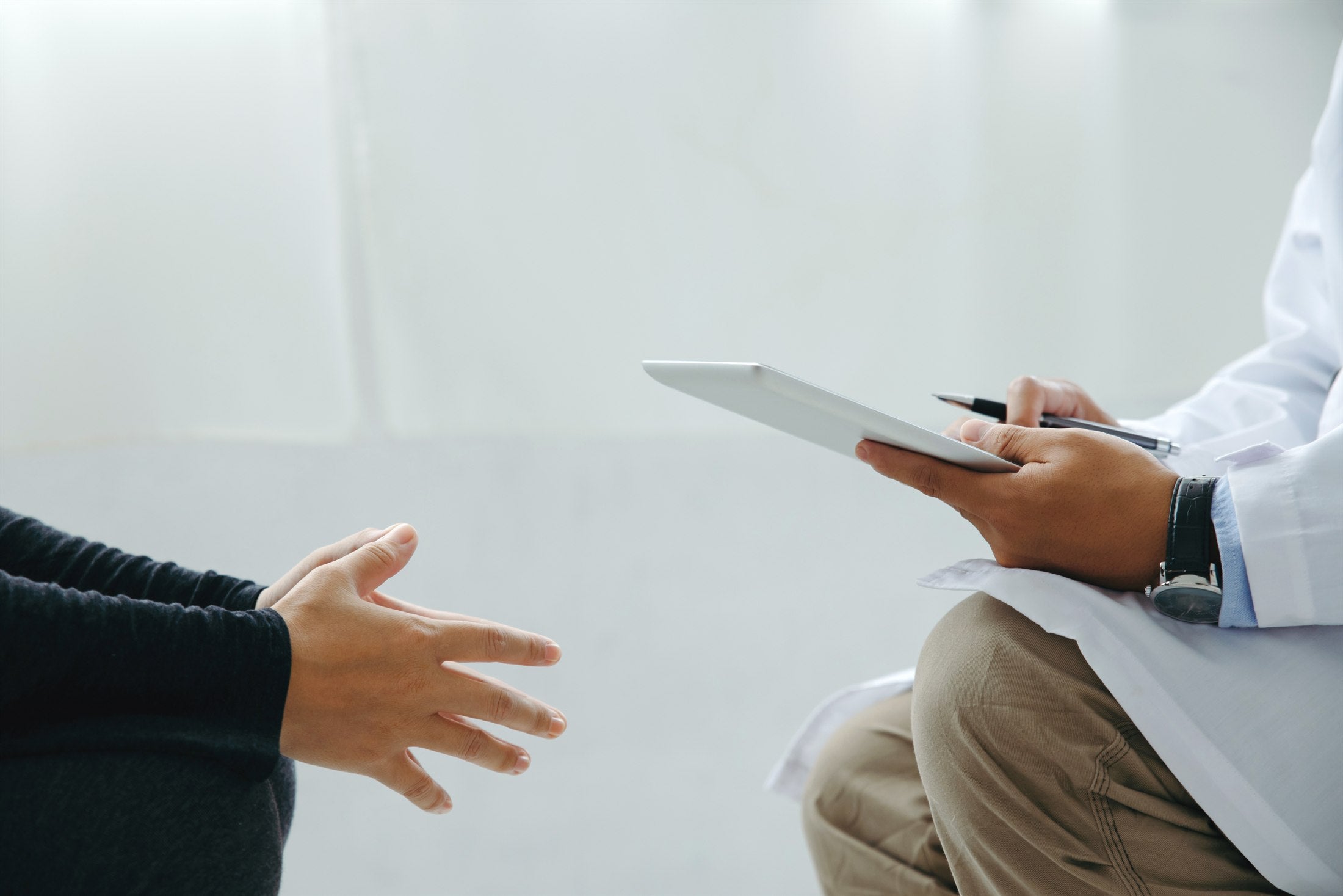 Doctor and patient discussing first steps after diagnosis